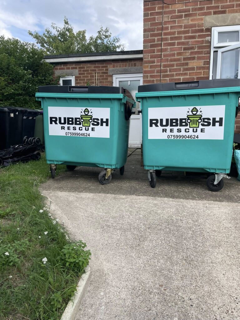 Two large waste bins with the Rubbish Rescue logo on