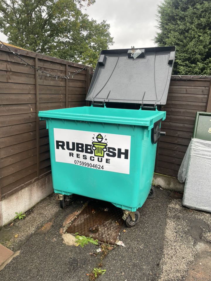A large open bin with Rubbish Rescue on it