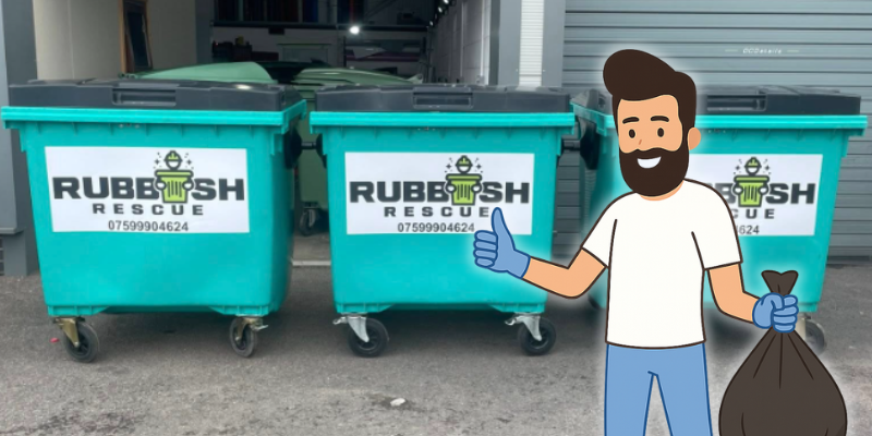 A friendly cartoon man stood in front of Rubbish Rescue branded bins